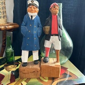 Two hand carved seamen